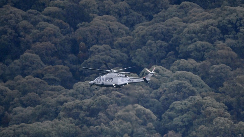 Police search Australian bush for gunman after two officers killed