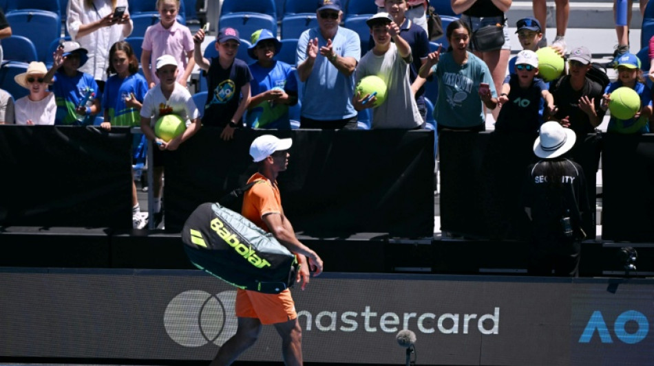 Auger-Aliassime retires in Melbourne heat with cramp