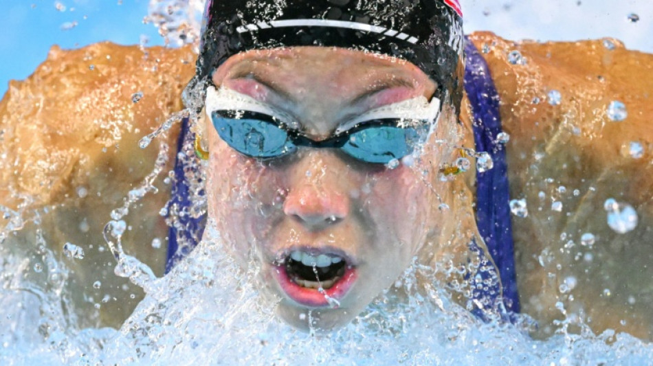 'Fragile' Walsh defies illness to win butterfly world gold
