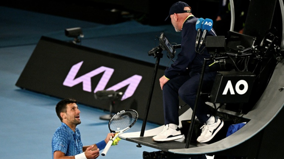 Djokovic 'worried' by injury but makes Australian Open third round 