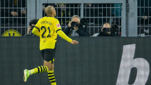 Malen double fires Dortmund past Freiburg
