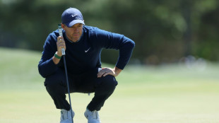 McIlroy's back-nine birdie run grabs share of Masters lead