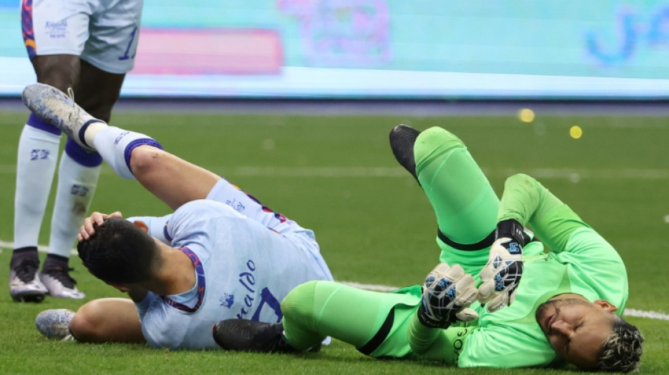 Ronaldo punched but scores twice in Saudi reunion with Messi