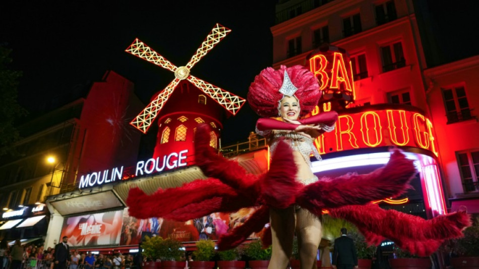 Moulin Rouge windmill twirls again 14 months after accident