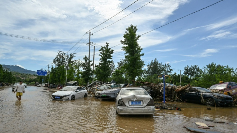 Beijing lifts rain alert after evacuating over 80,000