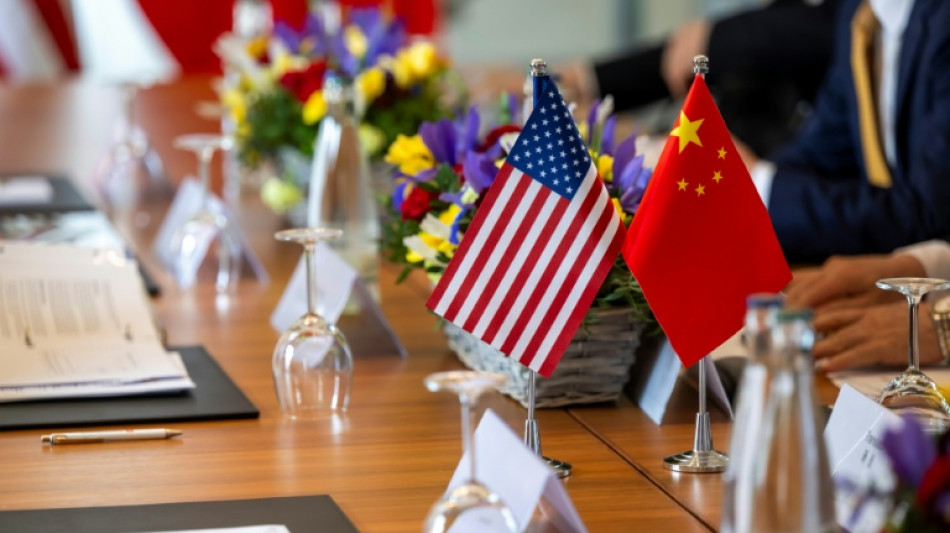 Wall Street climbs on easing US-China tensions, cool US inflation