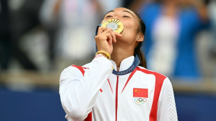 Zheng credits parents' tough love for Olympic gold