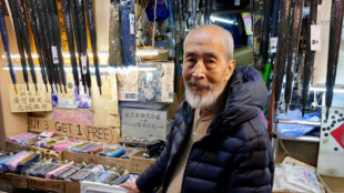 Hong Kongers bid farewell to 'king of umbrellas'